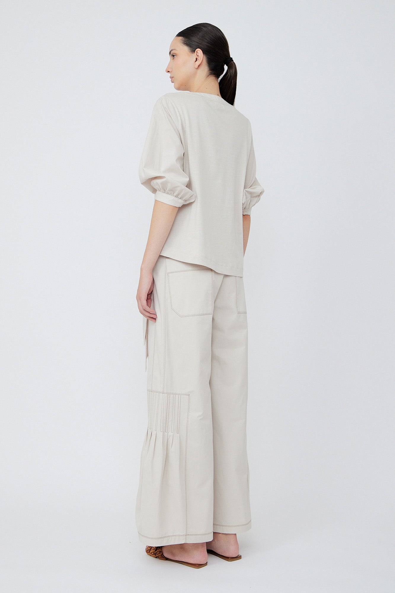 Zoila Pant in Prestine – High-waisted cotton palazzo pants with wide belt, contrast stitching, and refined silhouette.