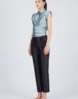 Eijan satin blouse in light blue, lavender, and magenta with pleated shoulder details and waist knot