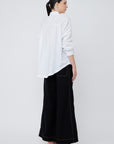 Elegant back view of the Hebe Blouse in its relaxed silhouette.