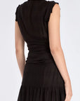 The Harlow Wrap Blouse in black, detailed with its polished metal buttons.