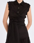 The Harlow Wrap Blouse in black, detailed with its polished metal buttons.