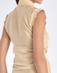 Elegant details of the vanilla Harlow Blouse, showing the shoulder pleats and wrap design.