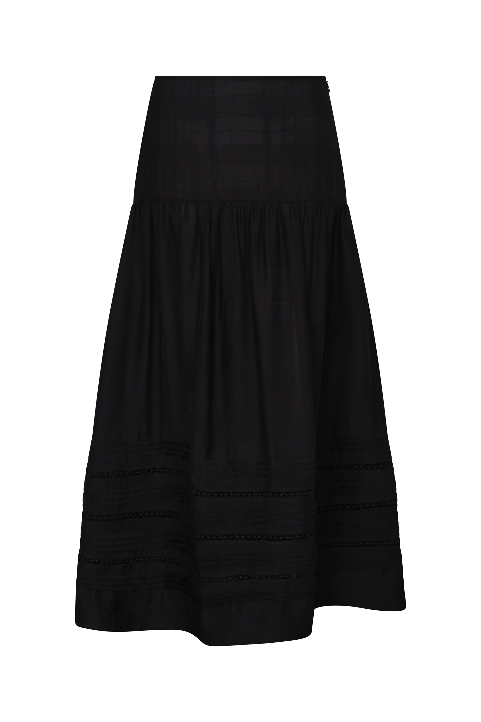 The Luanda Skirt in black, styled to showcase its high-waist fit and voluminous midi silhouette.