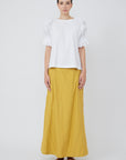 Nery top crafted from cotton knit and woven poplin, featuring a round neckline, short balloon sleeves with elastic, and a relaxed silhouette.