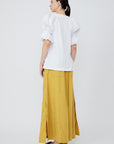 Nery top crafted from cotton knit and woven poplin, featuring a round neckline, short balloon sleeves with elastic, and a relaxed silhouette.