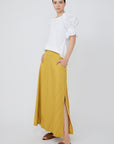 Nery top crafted from cotton knit and woven poplin, featuring a round neckline, short balloon sleeves with elastic, and a relaxed silhouette.