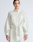 Ansley Blouse in Silver – Boho-inspired cotton blouse with patch pockets, balloon sleeves, and front tie.