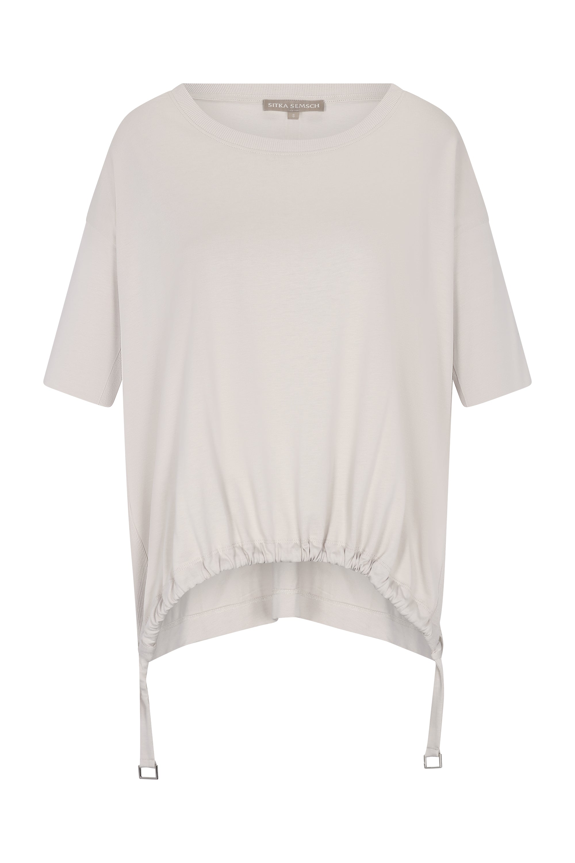 Amaya Top in Prestine – Cotton short-sleeve top with asymmetric hemline and metal-tipped buckle drawstrings.