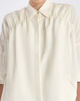 Detail shot of the polished metal button and linen blend texture on the Off White Ailani Jacket.