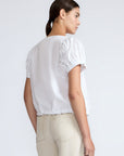 Amara blouse in white with broderie appliques and adjustable drawstring