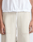 Amara blouse in white with broderie appliques and adjustable drawstring