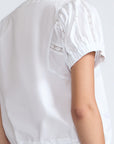 Amara blouse in white with broderie appliques and adjustable drawstring