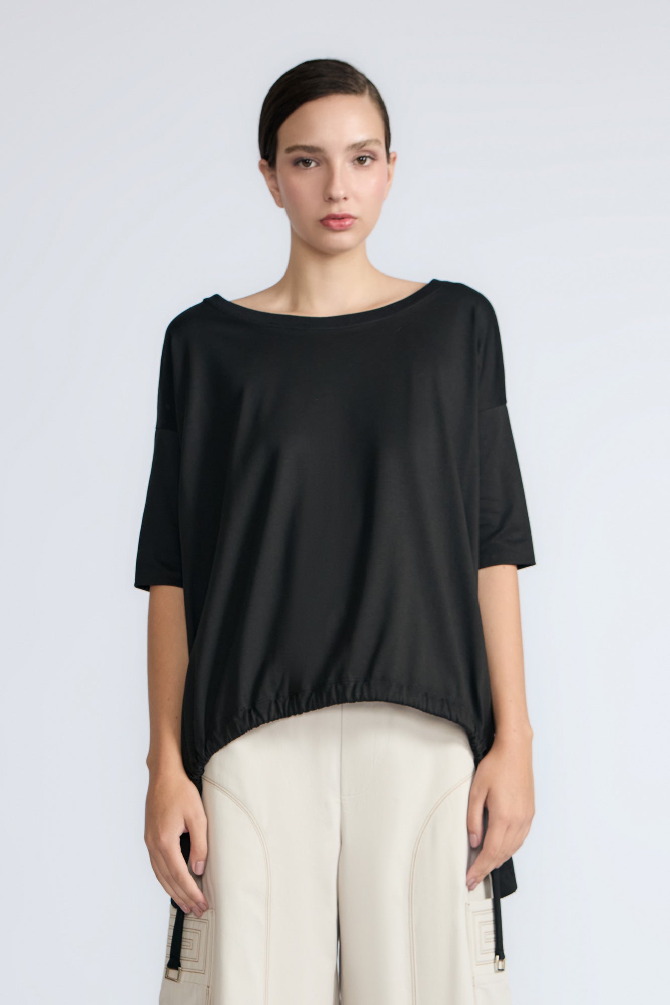 Amaya Top in Black – Round neck cotton top with short sleeves and side buckle pullers, made in Peru.