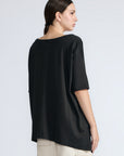 Amaya Top in Black – Round neck cotton top with short sleeves and side buckle pullers, made in Peru.