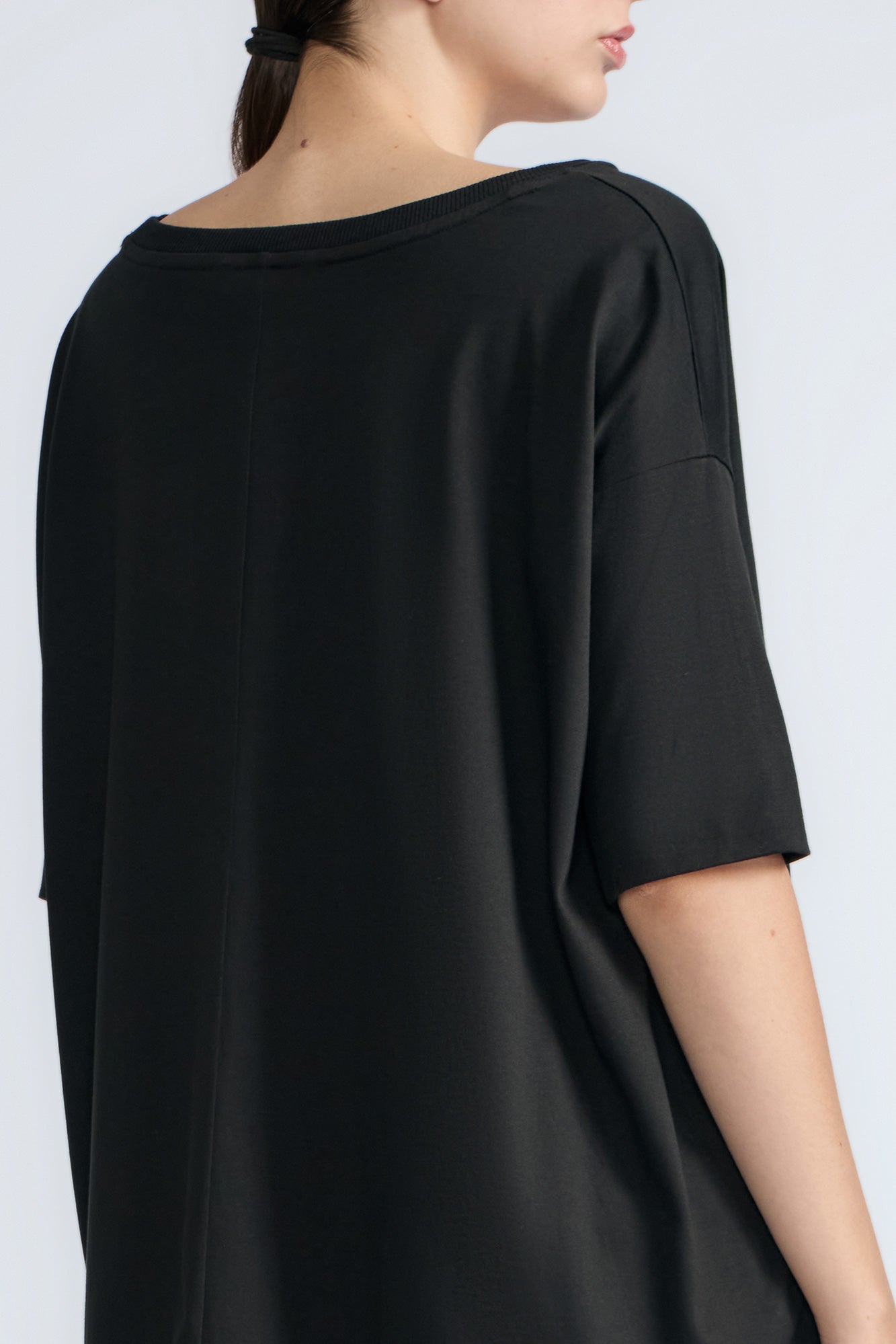 Amaya Top in Black – Round neck cotton top with short sleeves and side buckle pullers, made in Peru.