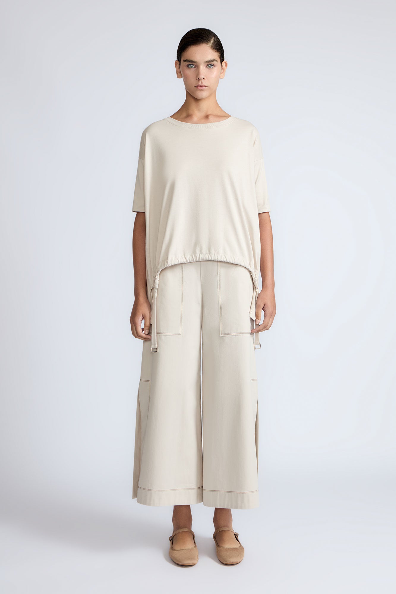 Amaya Top in Prestine – Cotton short-sleeve top with asymmetric hemline and metal-tipped buckle drawstrings.