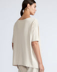 Amaya Top in Prestine – Cotton short-sleeve top with asymmetric hemline and metal-tipped buckle drawstrings.