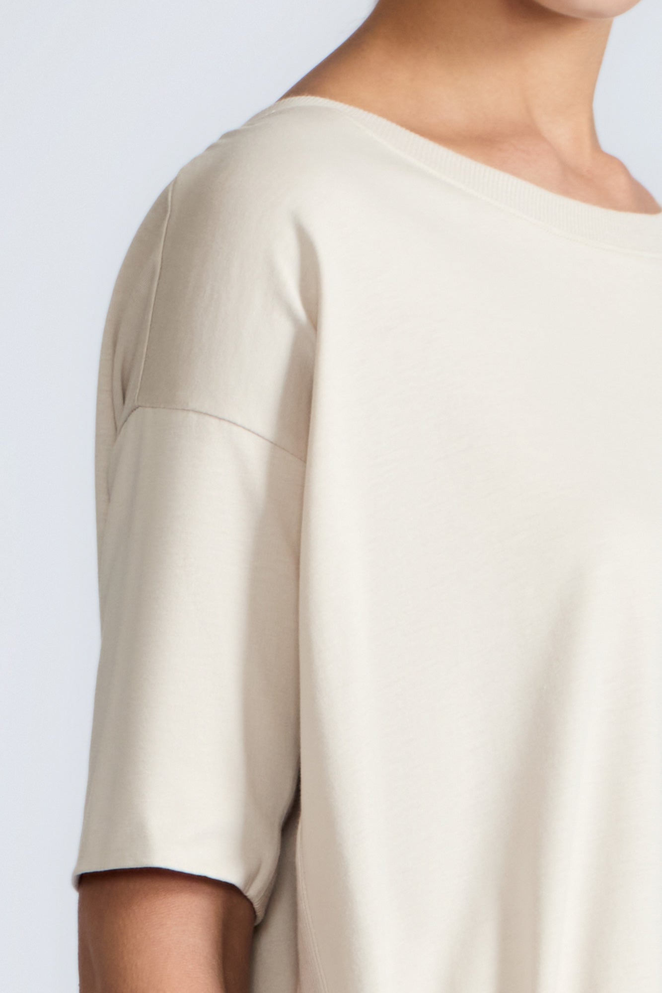 Amaya Top in Prestine – Cotton short-sleeve top with asymmetric hemline and metal-tipped buckle drawstrings.