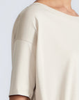 Amaya Top in Prestine – Cotton short-sleeve top with asymmetric hemline and metal-tipped buckle drawstrings.