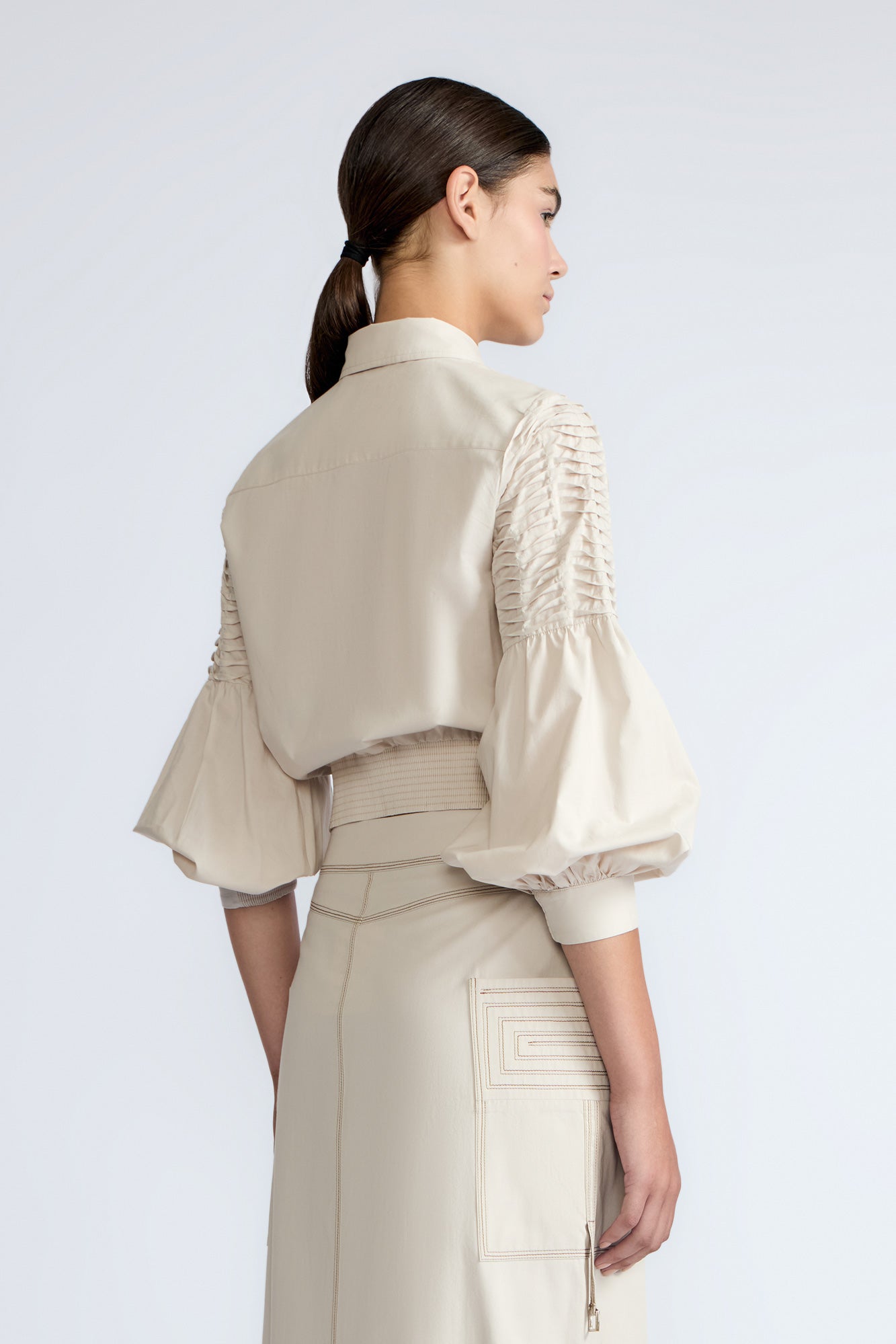 Ansley Blouse in Prestine – Lightweight cotton blouse with tie waist, balloon sleeves, and shirt collar.
