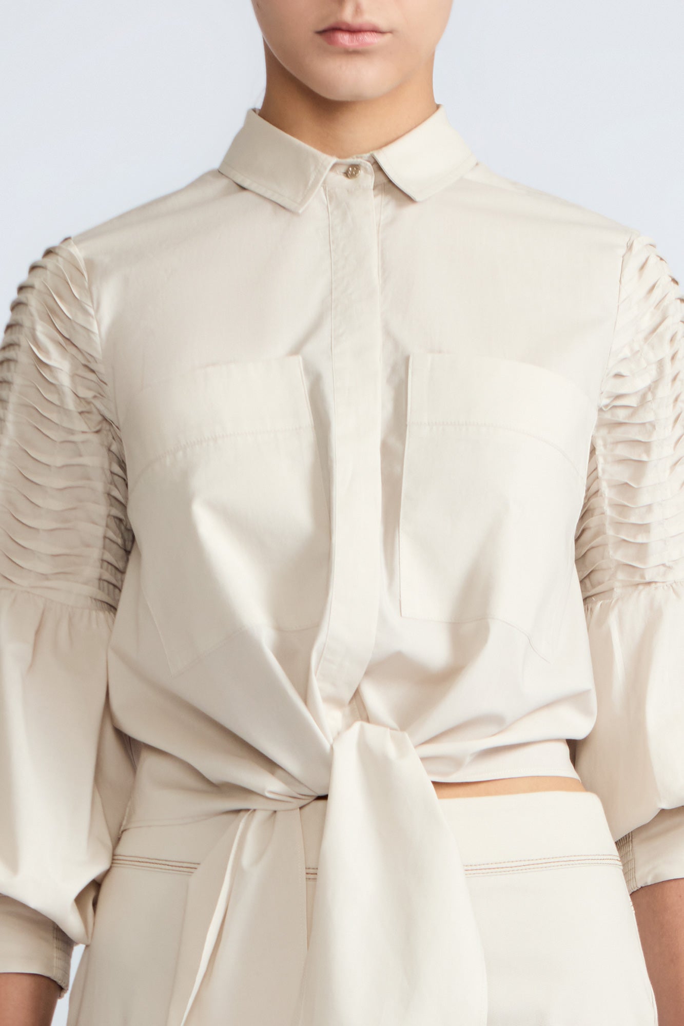 Ansley Blouse in Prestine – Lightweight cotton blouse with tie waist, balloon sleeves, and shirt collar.