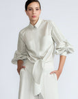 Ansley Blouse in Silver – Boho-inspired cotton blouse with patch pockets, balloon sleeves, and front tie.