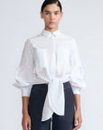 Ansley Blouse in White – Relaxed-fit cotton blouse with shirt collar, button front, and tied waist detail.