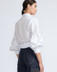 Ansley Blouse in White – Relaxed-fit cotton blouse with shirt collar, button front, and tied waist detail.