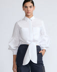 Ansley Blouse in White – Relaxed-fit cotton blouse with shirt collar, button front, and tied waist detail.