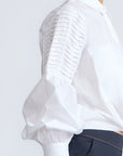 Ansley Blouse in White – Relaxed-fit cotton blouse with shirt collar, button front, and tied waist detail.
