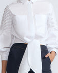 Ansley Blouse in White – Relaxed-fit cotton blouse with shirt collar, button front, and tied waist detail.
