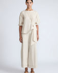 Artemisa Top in Prestine – 100% cotton top with round neckline, wrap tie at the waist, and ¾ sleeves.
