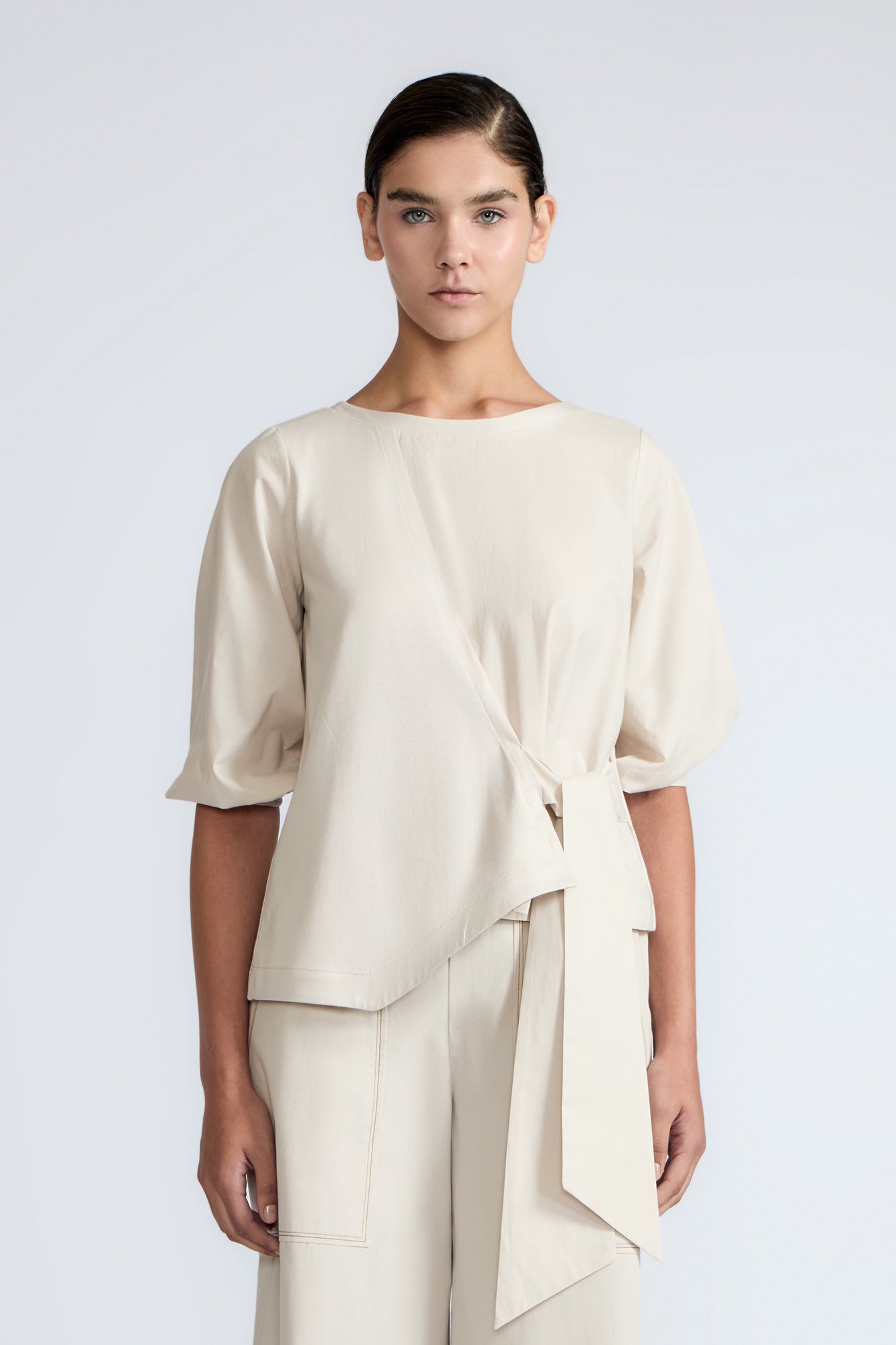 Artemisa Top in Prestine – 100% cotton top with round neckline, wrap tie at the waist, and ¾ sleeves.