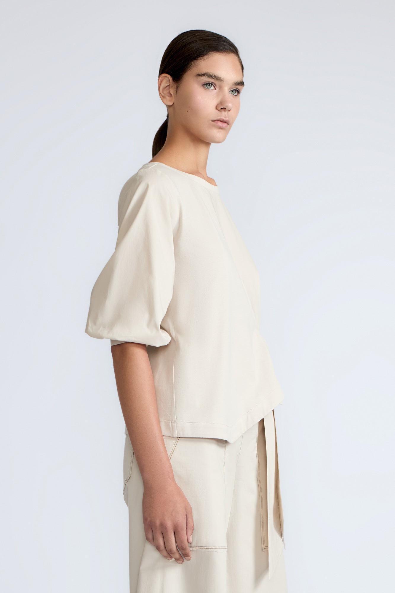 Artemisa Top in Prestine – 100% cotton top with round neckline, wrap tie at the waist, and ¾ sleeves.