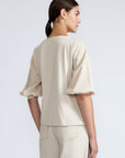 Artemisa Top in Prestine – 100% cotton top with round neckline, wrap tie at the waist, and ¾ sleeves.