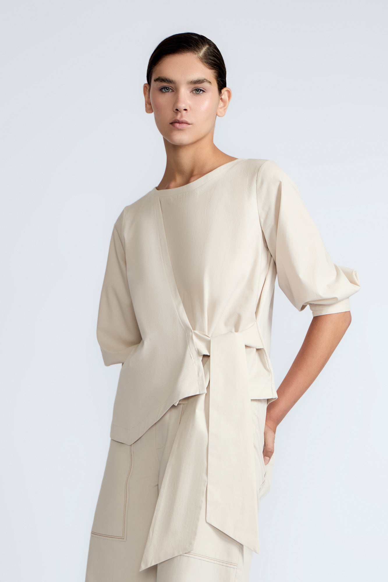 Artemisa Top in Prestine – 100% cotton top with round neckline, wrap tie at the waist, and ¾ sleeves.