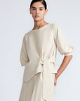 Artemisa Top in Prestine – 100% cotton top with round neckline, wrap tie at the waist, and ¾ sleeves.