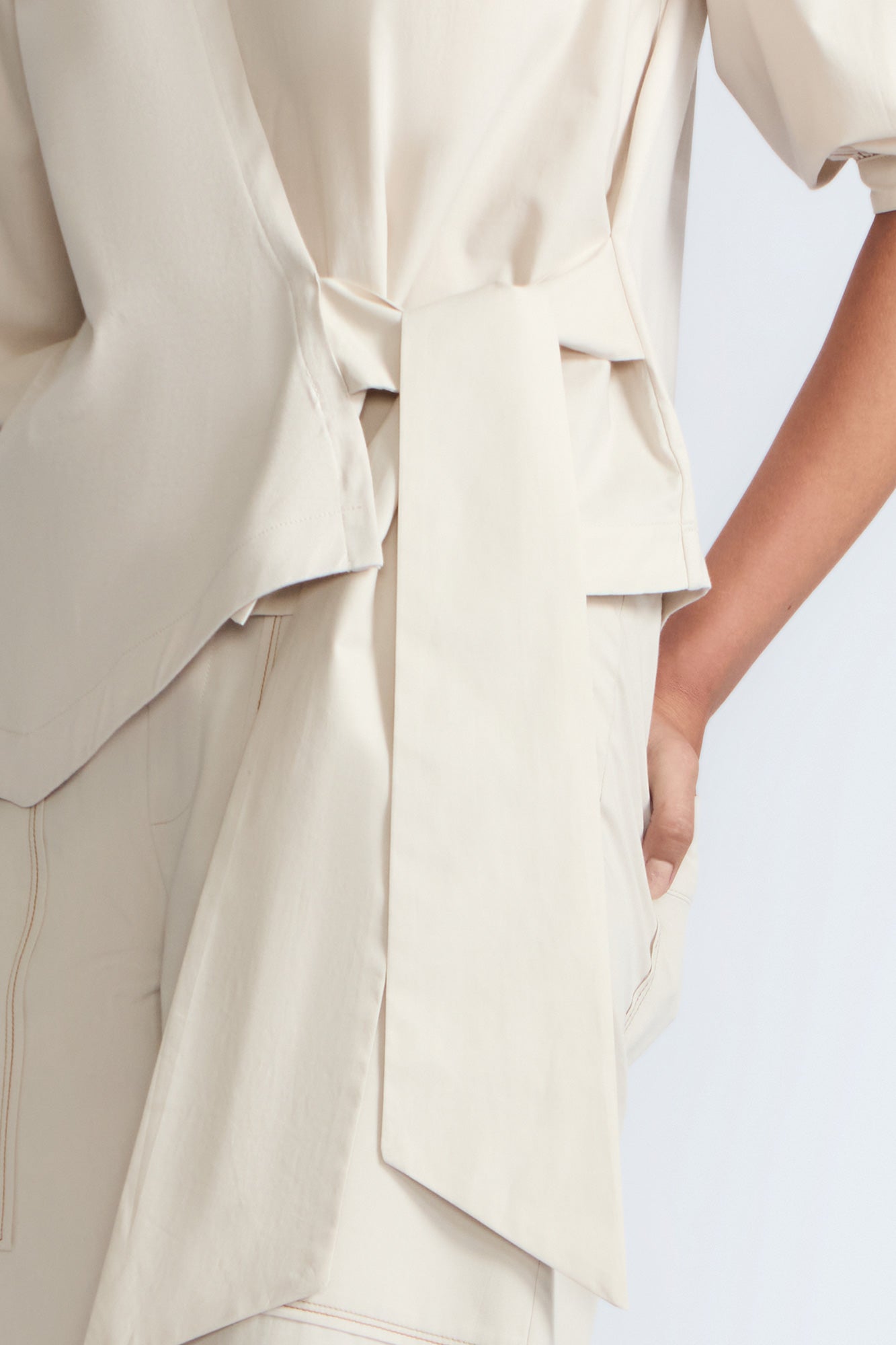 Artemisa Top in Prestine – 100% cotton top with round neckline, wrap tie at the waist, and ¾ sleeves.