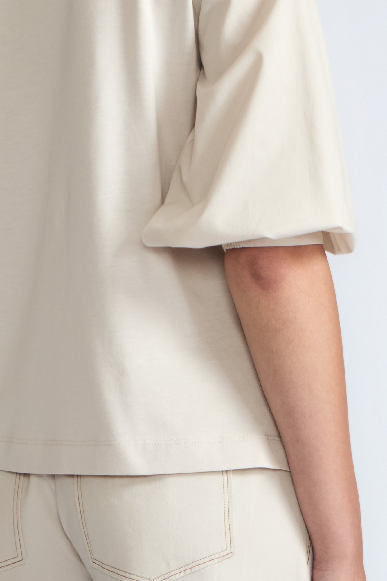 Artemisa Top in Prestine – 100% cotton top with round neckline, wrap tie at the waist, and ¾ sleeves.