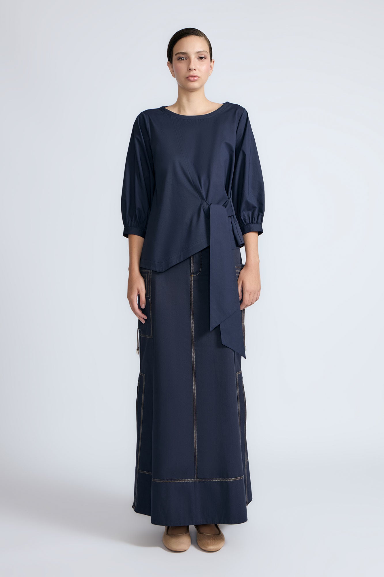 Artemisa Top in Navy – Cotton wrap top with round neckline, ¾ sleeves, and tie waist, made in Peru.