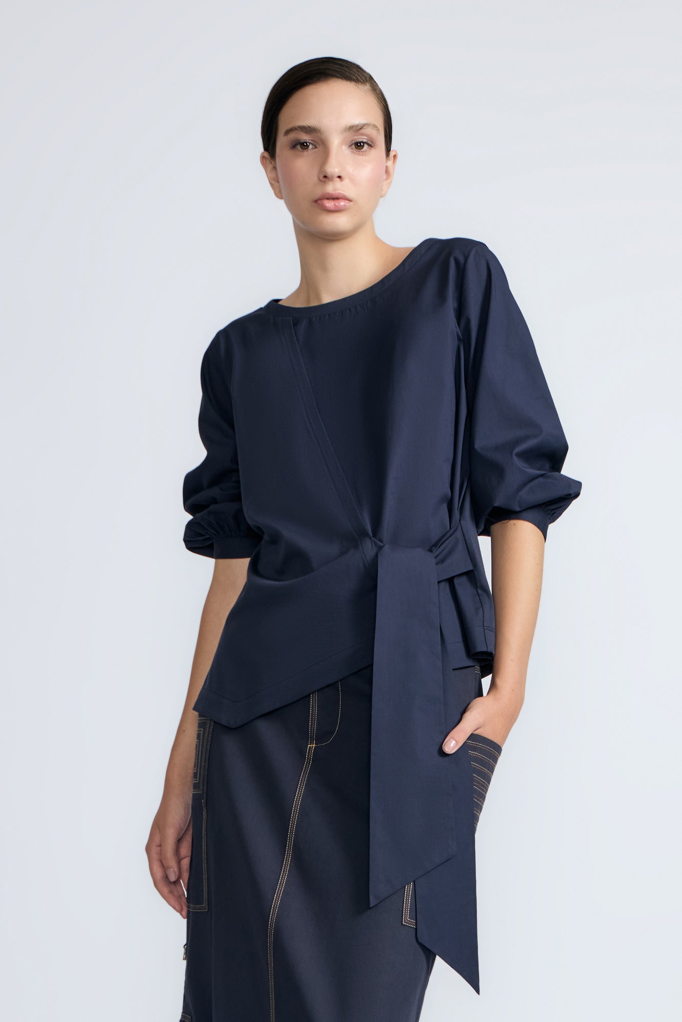 Artemisa Top in Navy – Cotton wrap top with round neckline, ¾ sleeves, and tie waist, made in Peru.