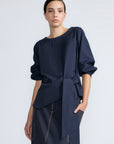 Artemisa Top in Navy – Cotton wrap top with round neckline, ¾ sleeves, and tie waist, made in Peru.