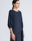Artemisa Top in Navy – Cotton wrap top with round neckline, ¾ sleeves, and tie waist, made in Peru.