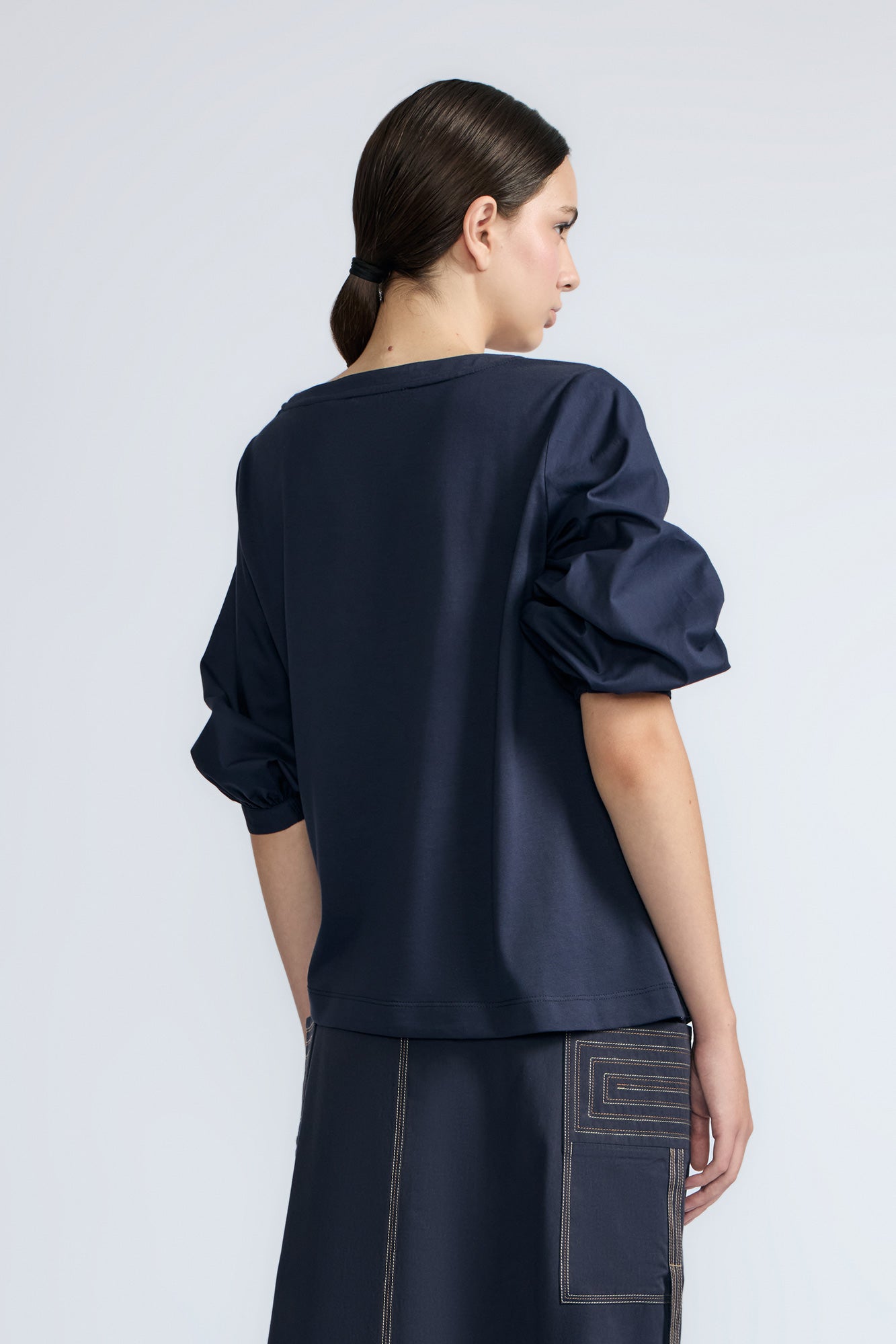 Artemisa Top in Navy – Cotton wrap top with round neckline, ¾ sleeves, and tie waist, made in Peru.