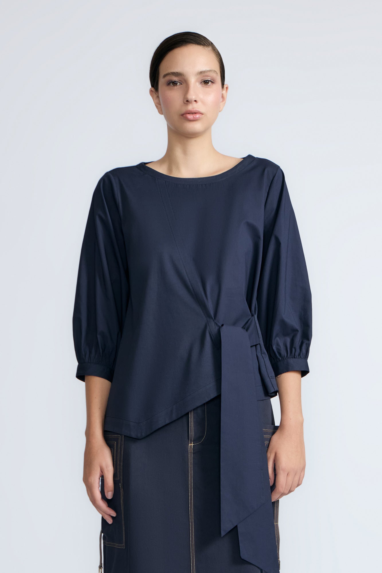 Artemisa Top in Navy – Cotton wrap top with round neckline, ¾ sleeves, and tie waist, made in Peru.