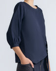 Artemisa Top in Navy – Cotton wrap top with round neckline, ¾ sleeves, and tie waist, made in Peru.
