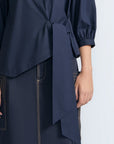 Artemisa Top in Navy – Cotton wrap top with round neckline, ¾ sleeves, and tie waist, made in Peru.