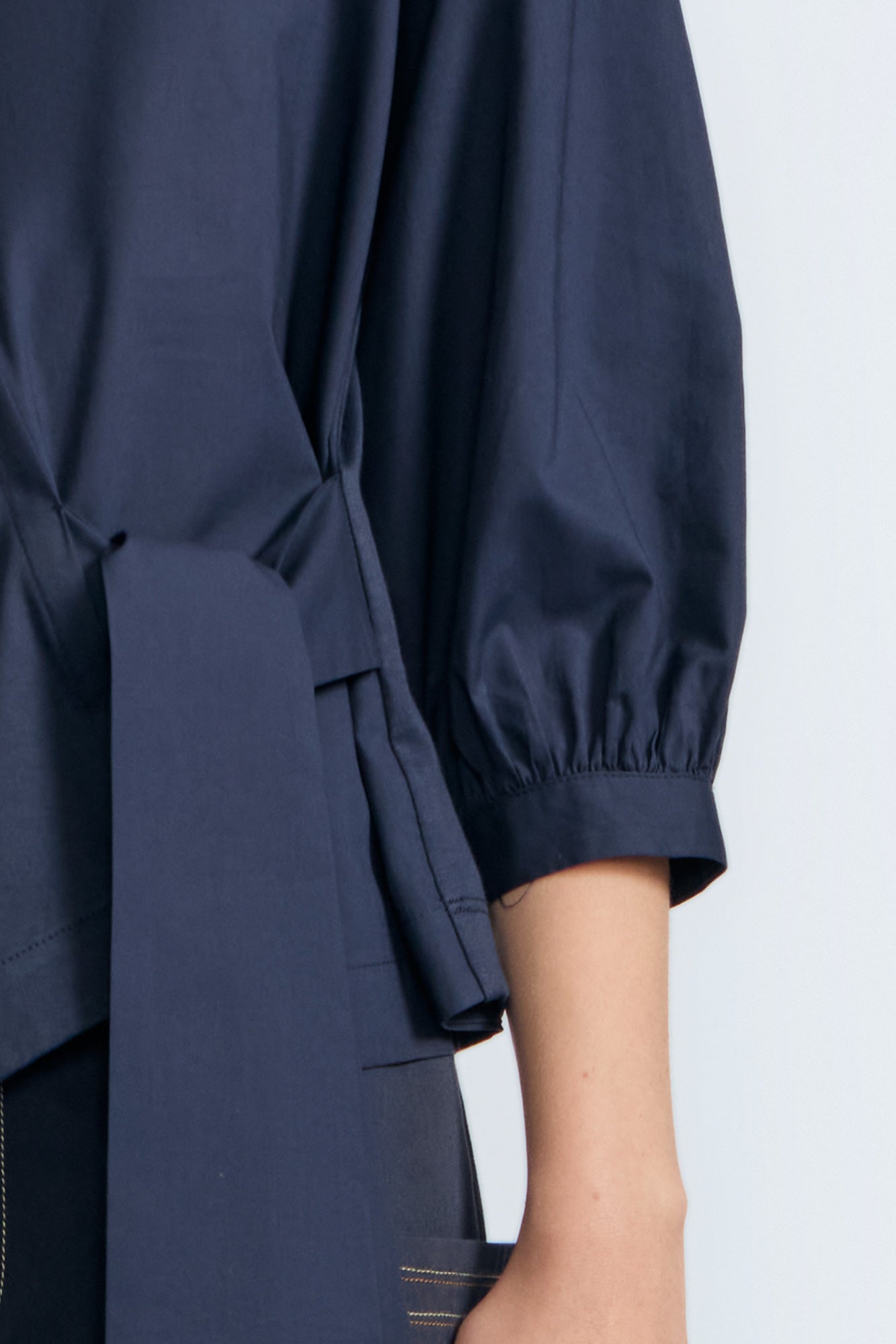 Artemisa Top in Navy – Cotton wrap top with round neckline, ¾ sleeves, and tie waist, made in Peru.