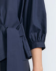 Artemisa Top in Navy – Cotton wrap top with round neckline, ¾ sleeves, and tie waist, made in Peru.