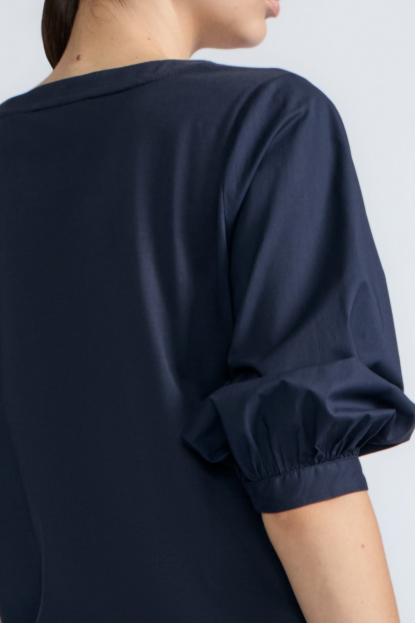 Artemisa Top in Navy – Cotton wrap top with round neckline, ¾ sleeves, and tie waist, made in Peru.